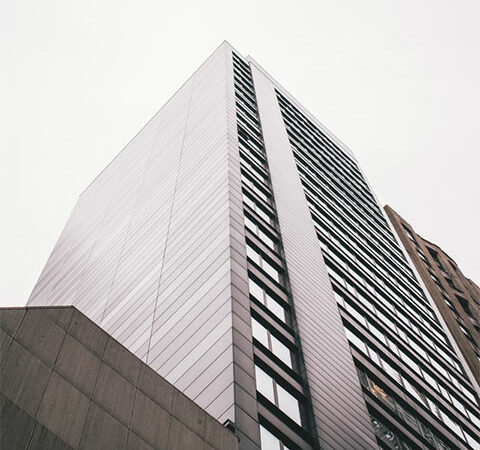 A towering building with a clock perched on its pinnacle, showcasing the passage of time.