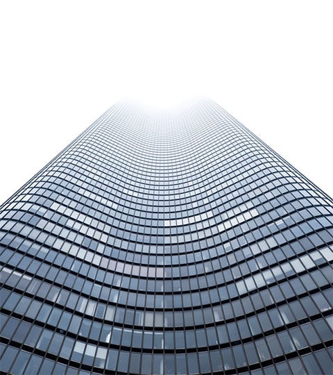 A towering building with numerous windows, offering a captivating view of urban architecture.