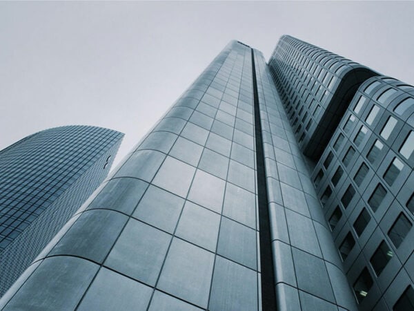 A cityscape with towering buildings against the sky.
